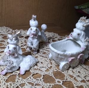 Porcelain poodle collection of 3. Roughly 5" x 4"